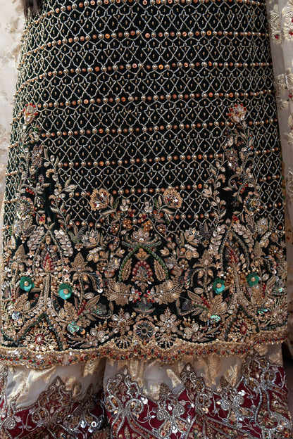 Close-up of a intricately designed fabric with embroidery and beads.