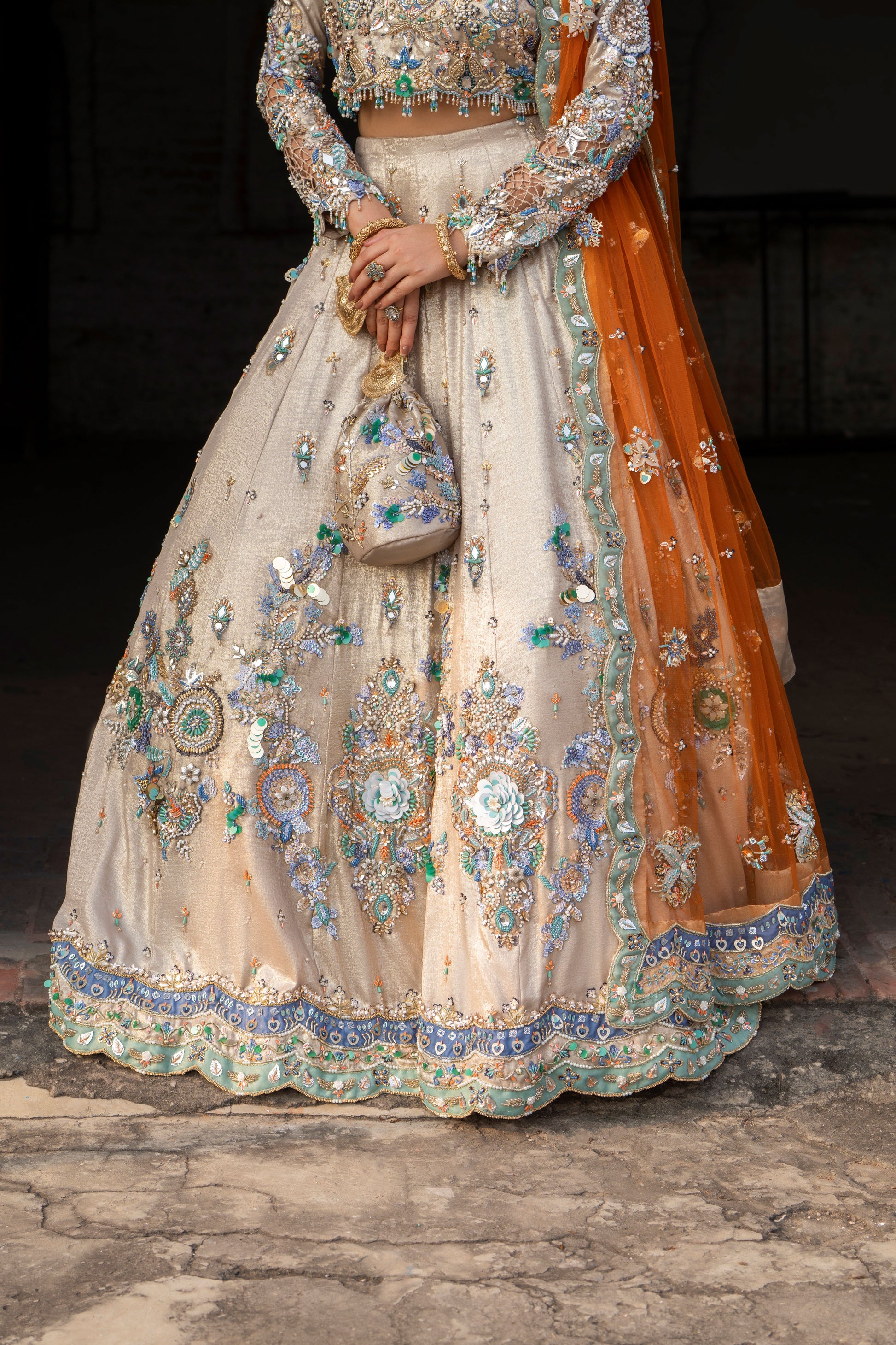 Elegant embroidered traditional outfit with a focus on intricate designs.